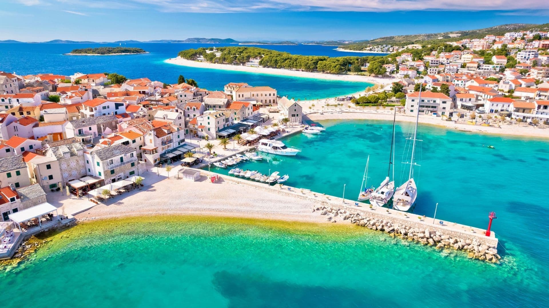 adriatic tourist town of primosten turquoise beach and seafront aerial view croatia