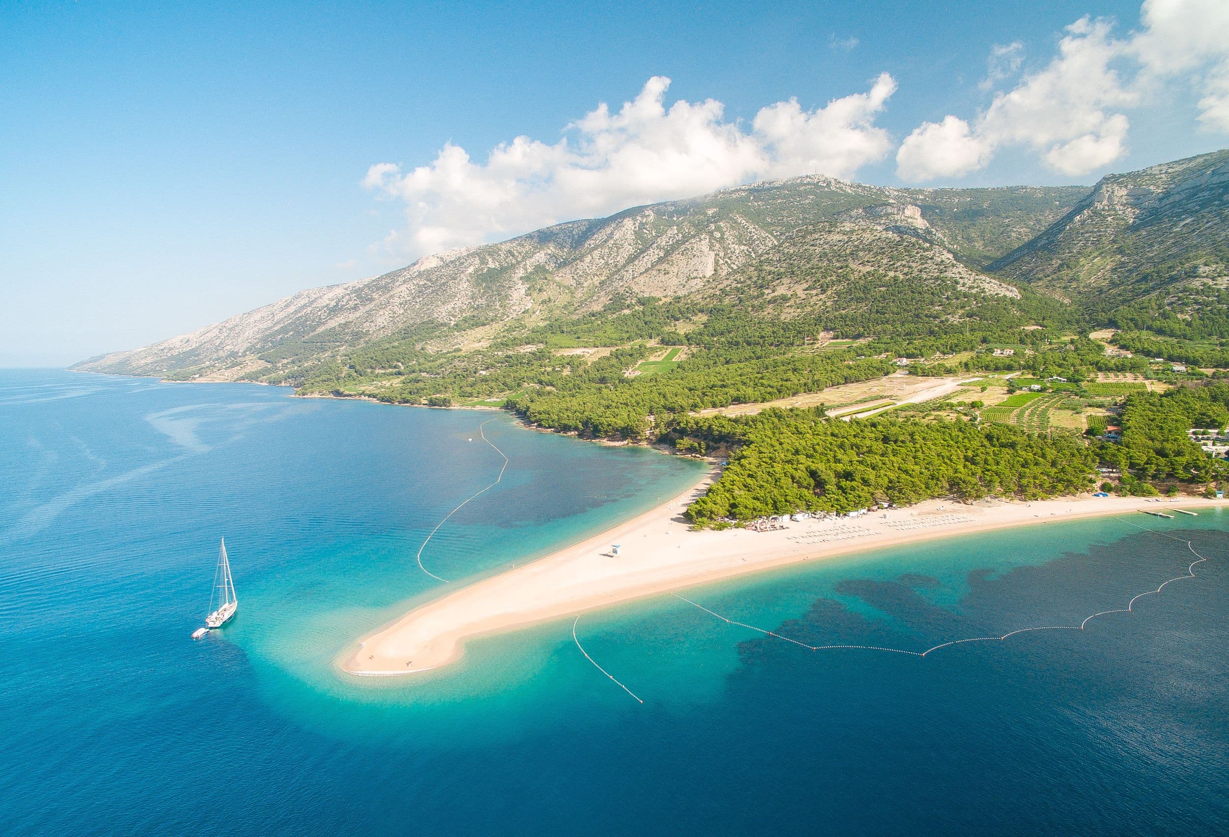 zlatni rat croatia blue water beach with mountains