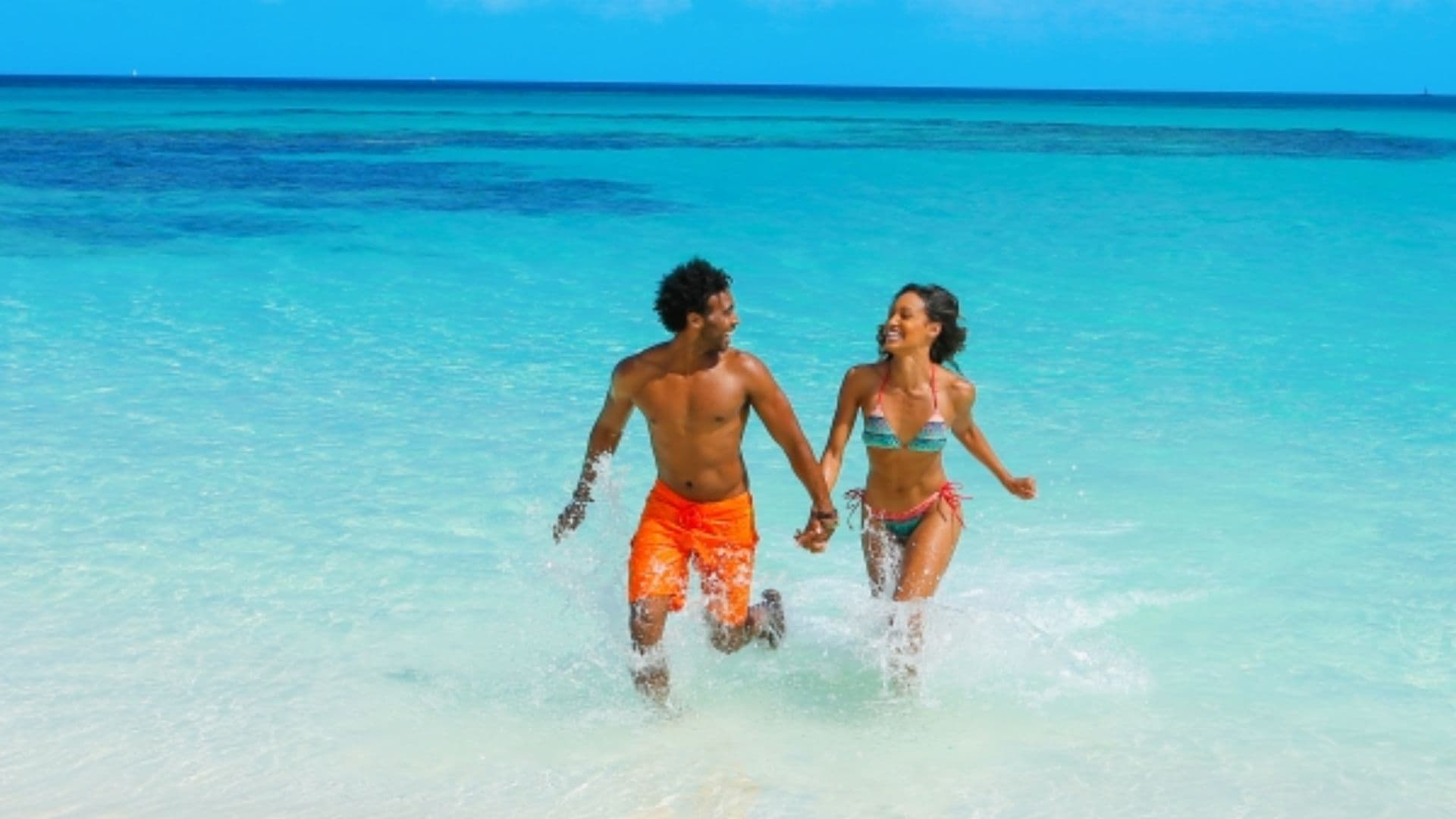 couple in water bahamas