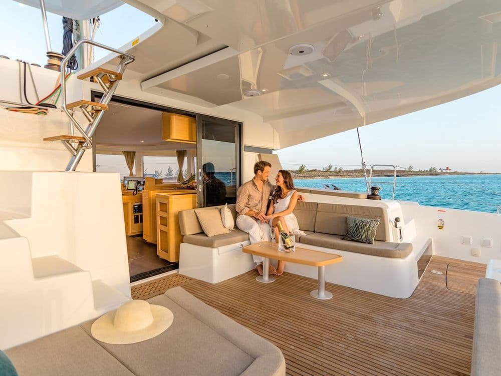 lagoon 42 olympios zeus two people sitting on the deck