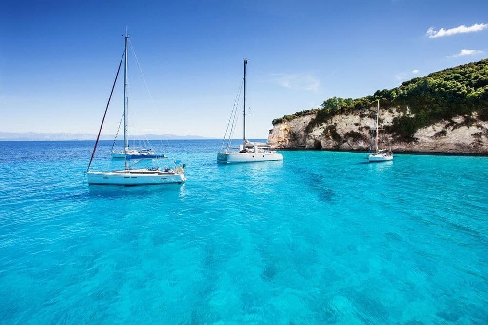 mediterranean three boats in blue water