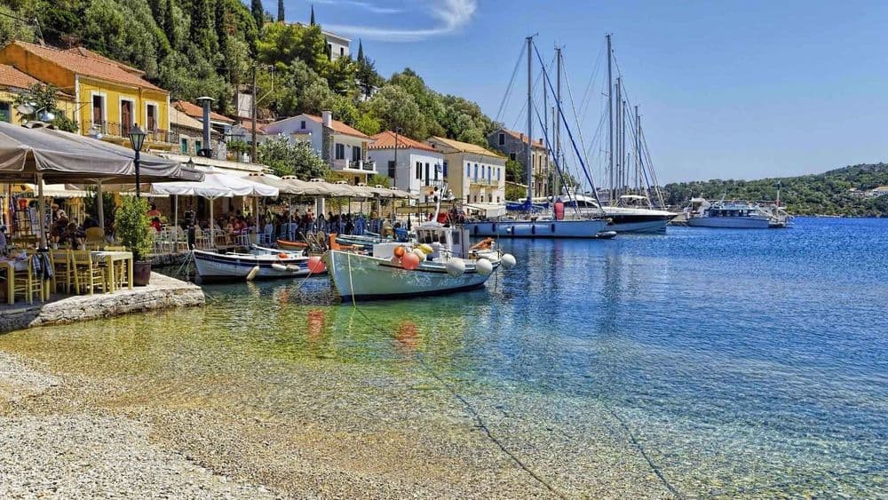 kioni harbour stone bay boats moored houses overlooking water