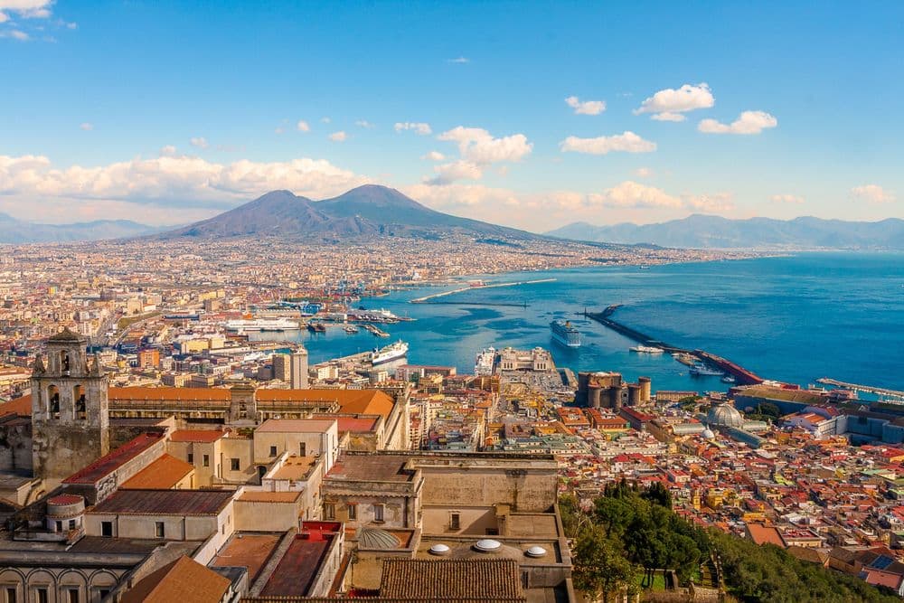 bay of naples italy town with mountains in back
