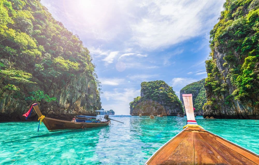 ko phi phi in thailand boat in bay with mountains