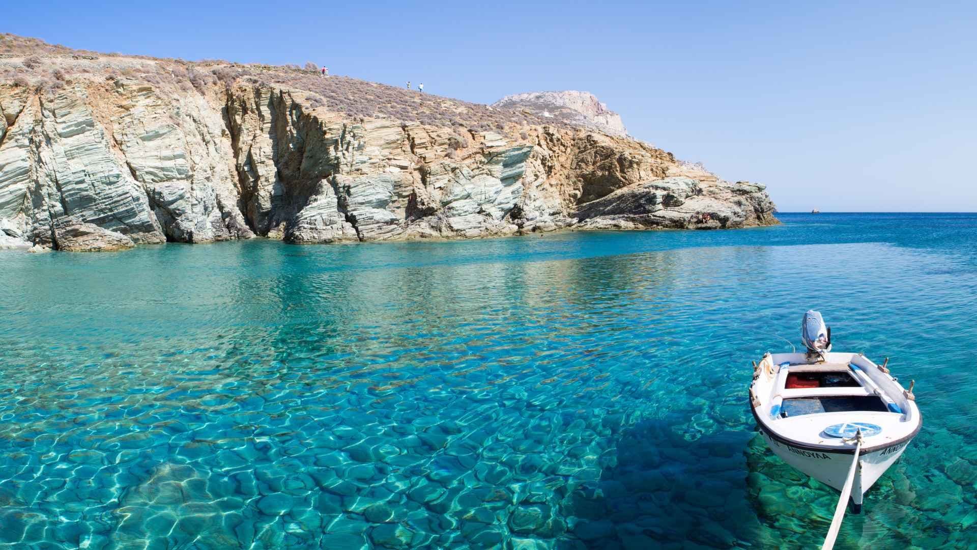 clear waters boat moored mountain folegandros greece