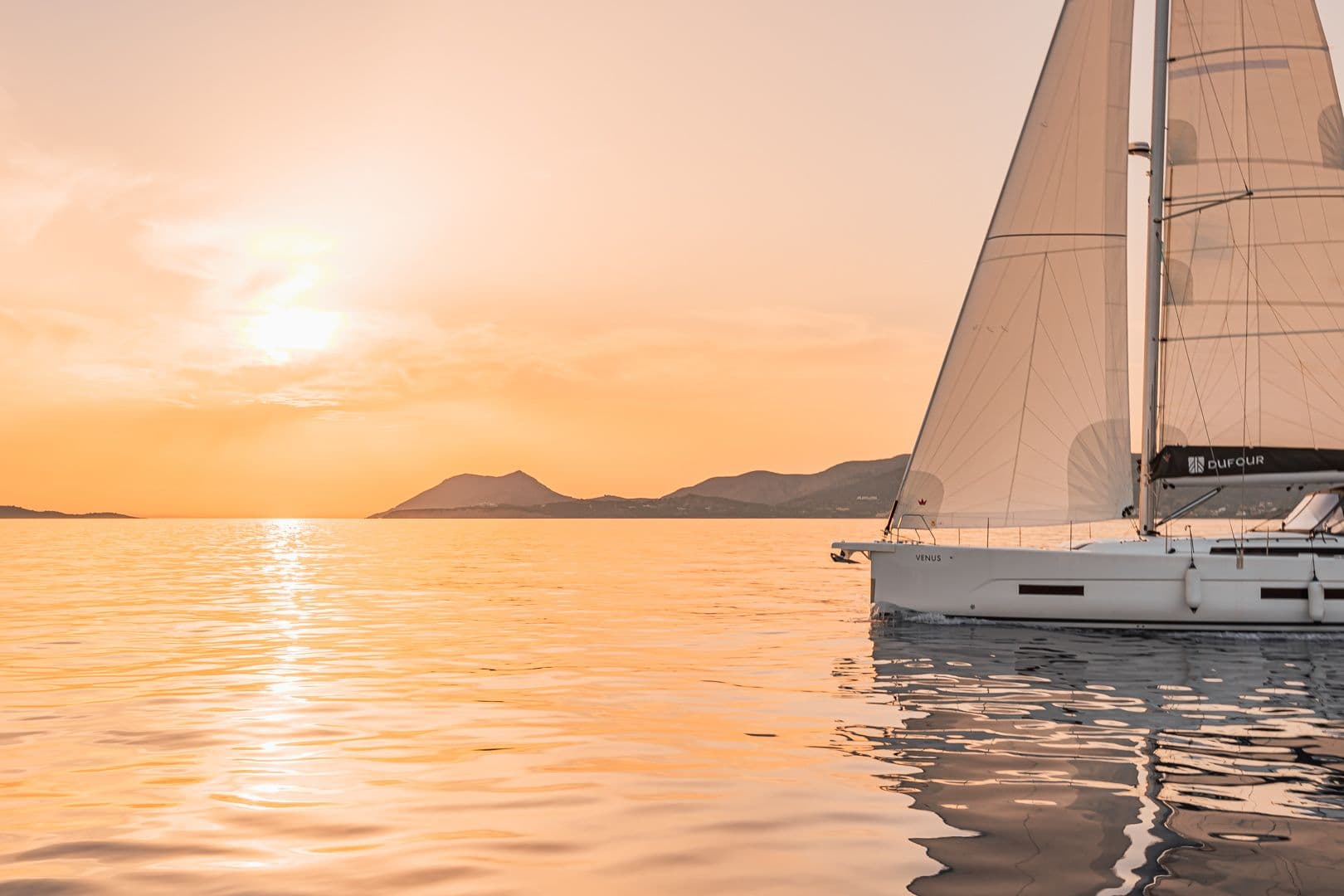dufour 530 venus exterior with a sunset