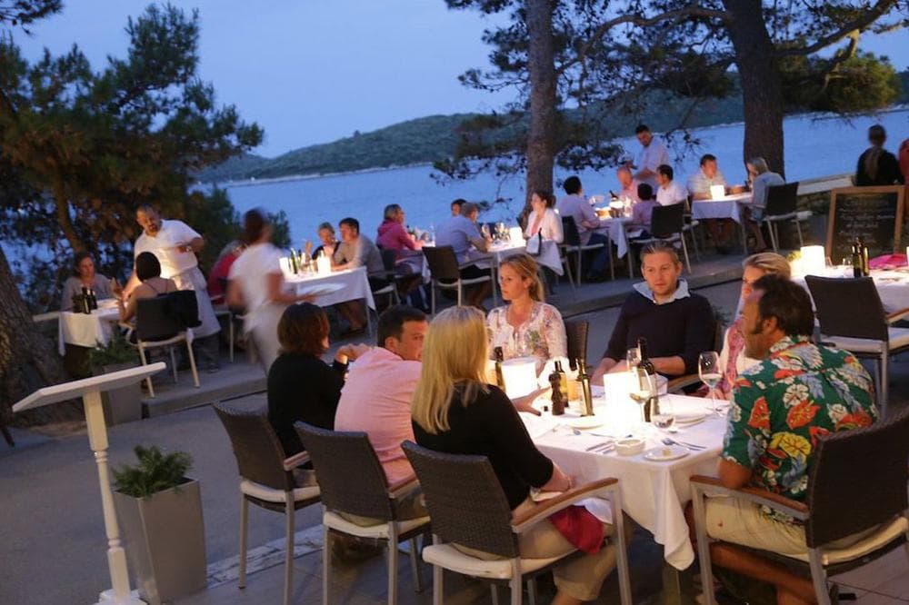 people guests sitting at restaurant dining out food